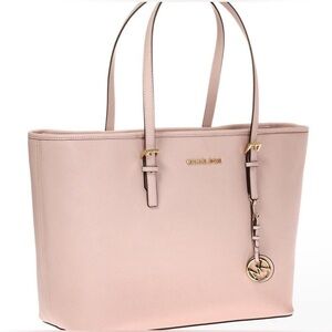 Well kept light Pink Michael Kors Jet set bag.